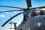 Military helicopter against a blue sky
