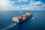 Ocean freight vessel heading out to sea laden with cargo containers