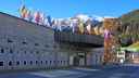 Front of hotel in Davos, Switzerland, underneath flags of world country draped on the front