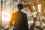 Businessman travelling along an escalator in an airport