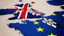 Lorries queuing on a cartoon map of UK and EU, with flags overlayed on both, 