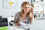 Woman at laptop with headphones on