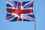 Union Jack flag flying against a blue sky