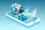 Cartoon of a businessman sitting at a desk on top of a phone and with a digital globe behind him