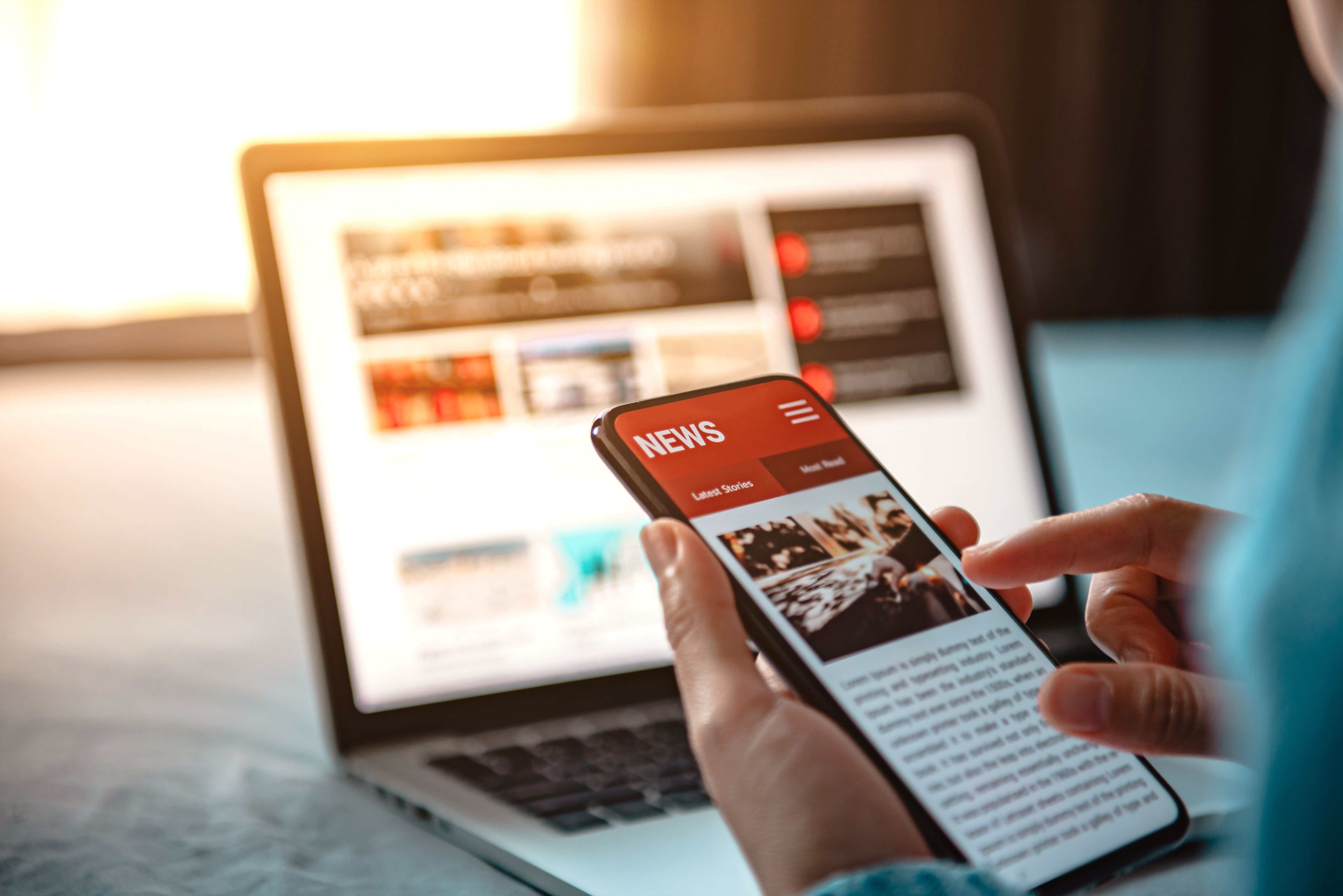 Person looking at news on phone